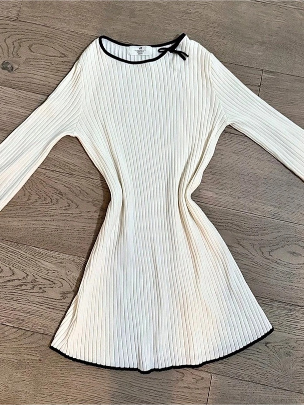 H&M cream/white ribbed long-sleeve mini dress with black trim and bow
